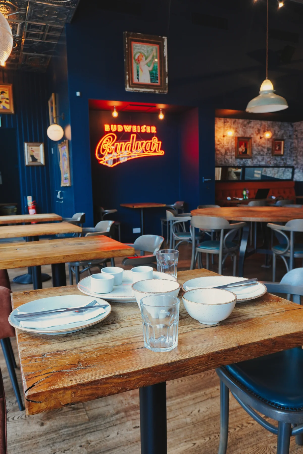 Set tables with an illuminated Bowland Brewery sign